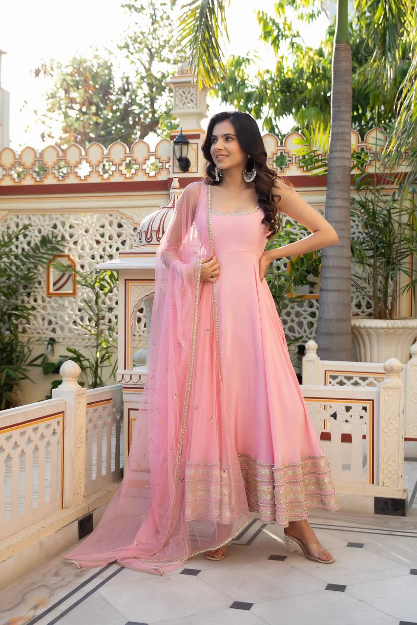 Radiant Beauty in Soft Pink Attire