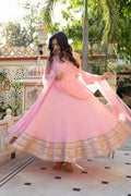 Radiant Beauty in Soft Pink Attire