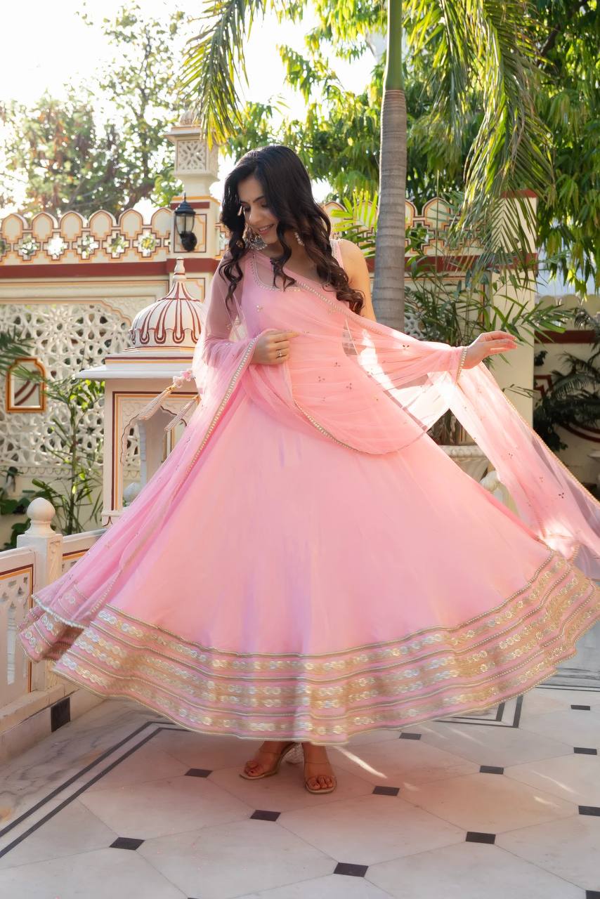 Radiant Beauty in Soft Pink Attire