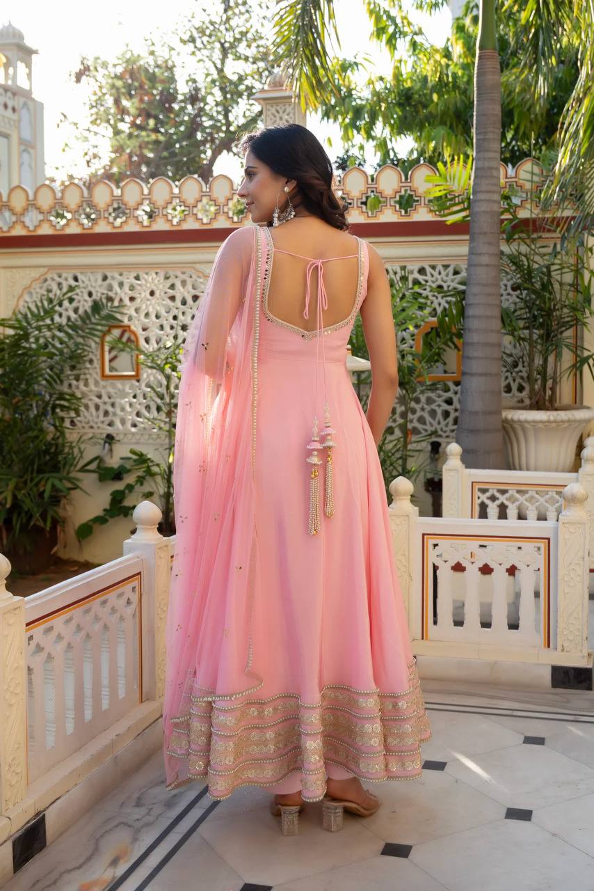 Radiant Beauty in Soft Pink Attire