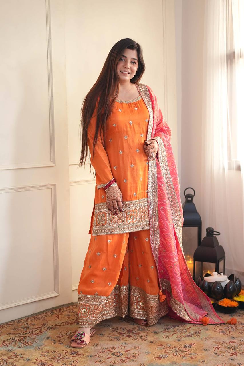 Stylish Orange Ensemble Paired with Pink Dupatta