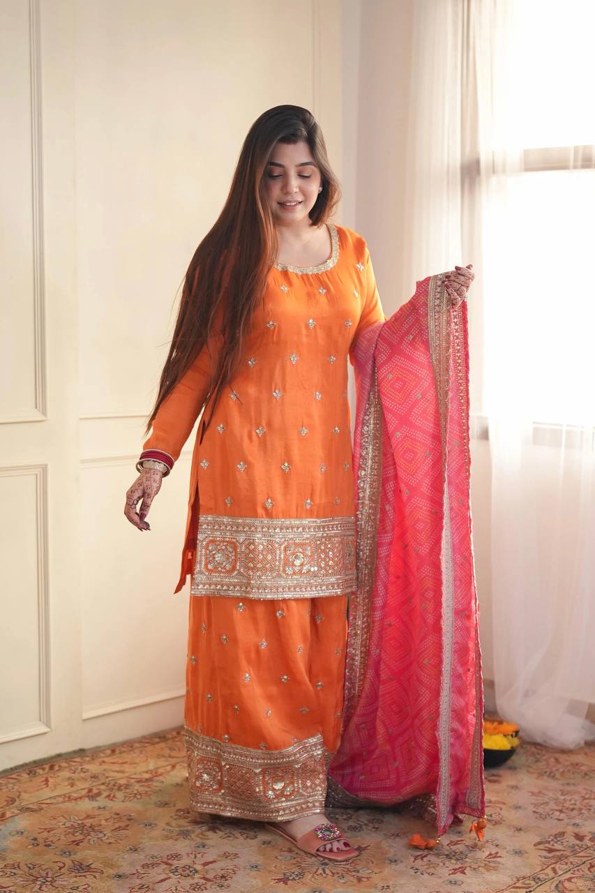 Stylish Orange Ensemble Paired with Pink Dupatta