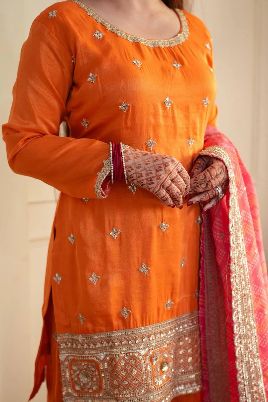 Stylish Orange Ensemble Paired with Pink Dupatta