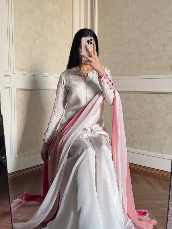 Embroidered white suit with pink dupatta