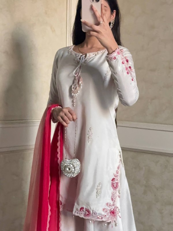 Embroidered white suit with pink dupatta