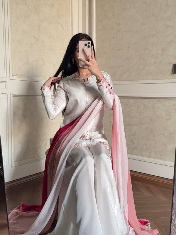 Embroidered white suit with pink dupatta