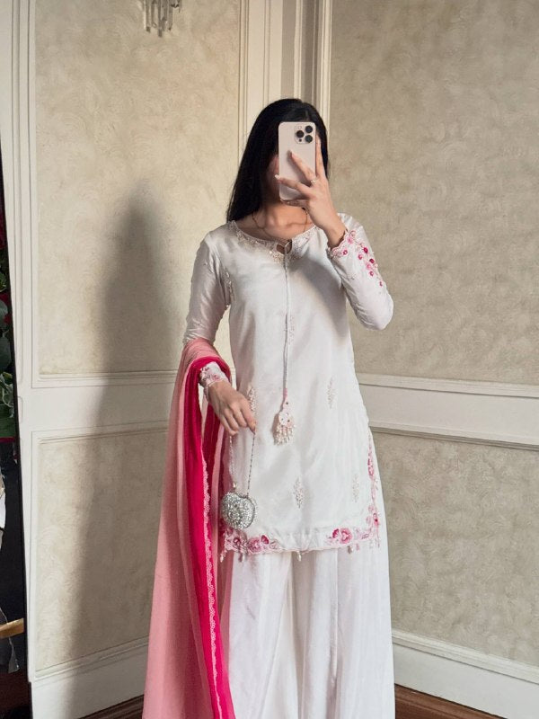 Embroidered white suit with pink dupatta