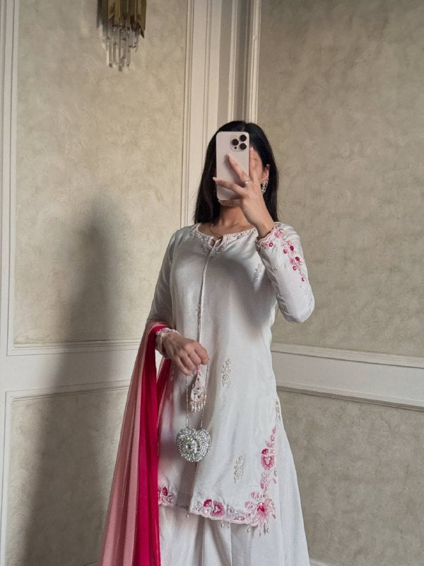 Embroidered white suit with pink dupatta