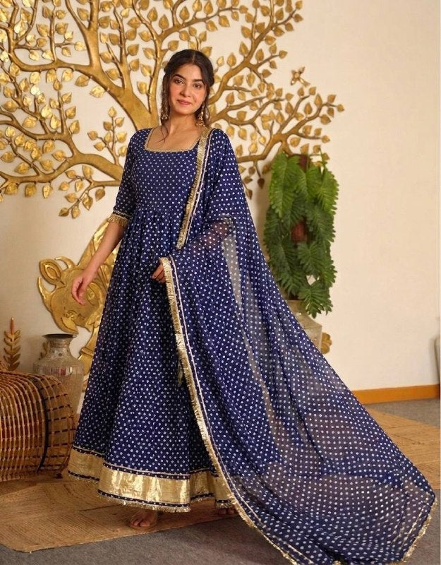 Graceful Indigo Anarkali Dress Adorned with Gold