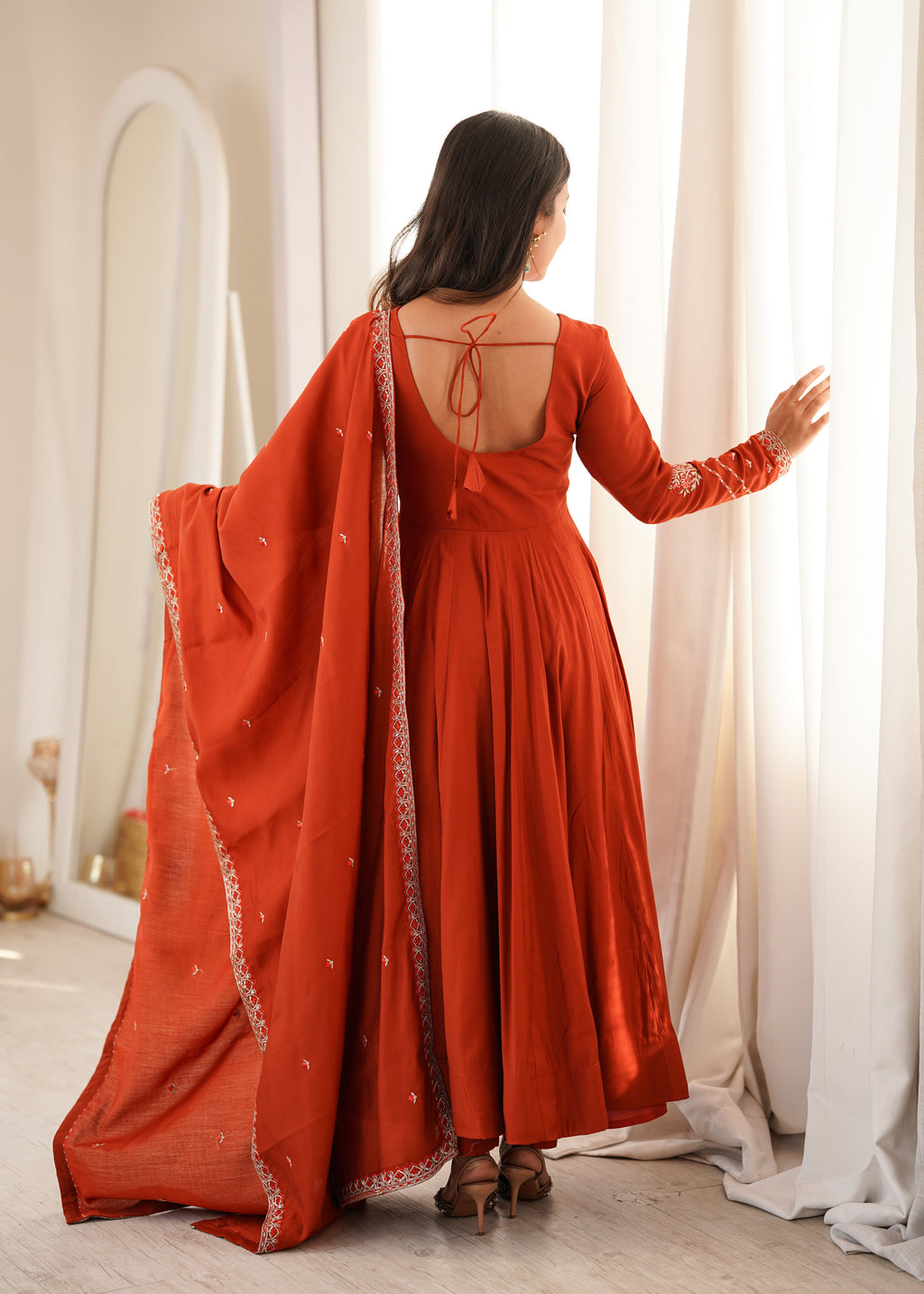 Bold Beauty Posing in Orange Elegance